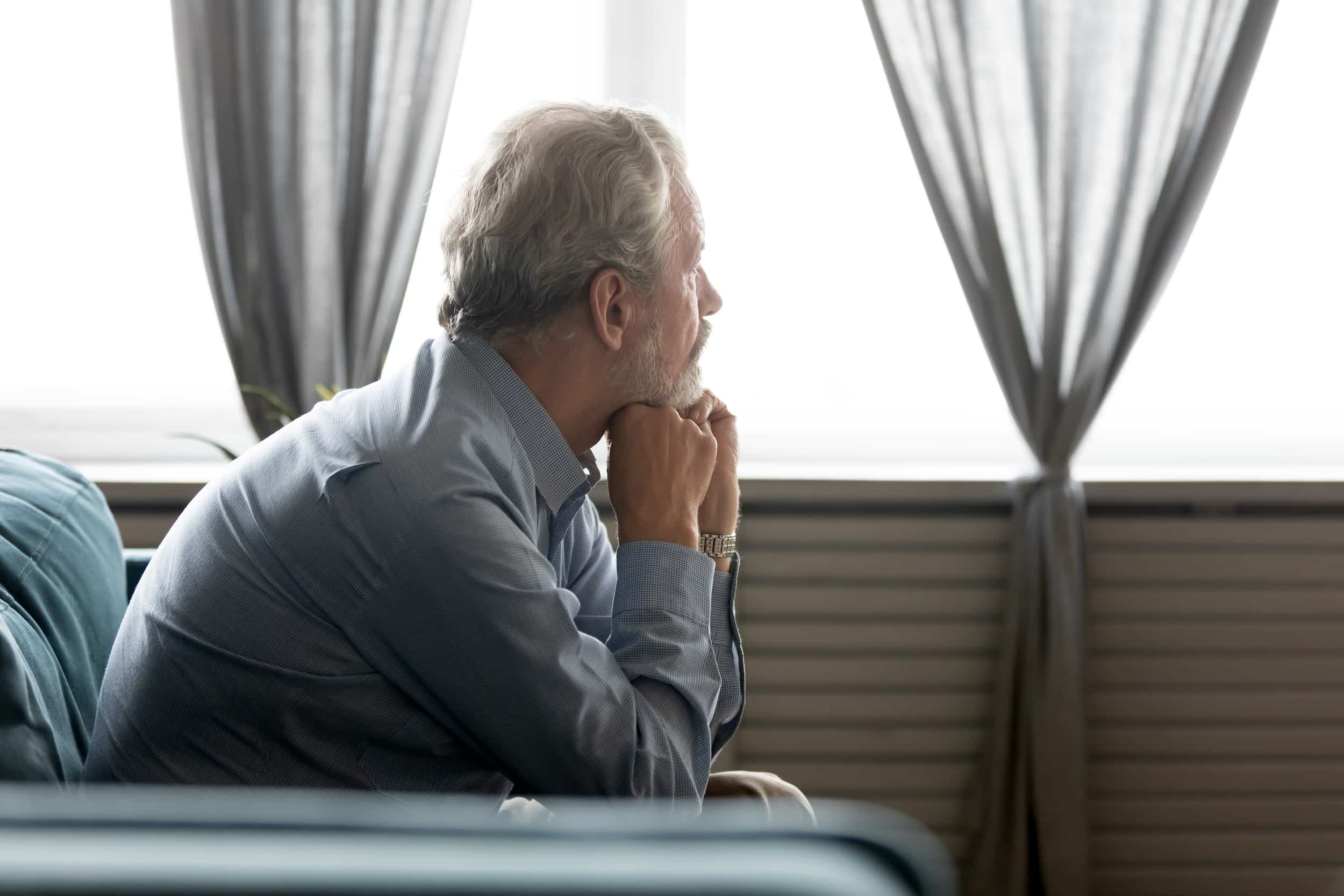 Prostate cancer patient sits in a waiting room