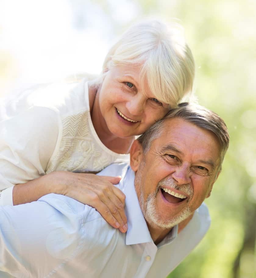 Focal therapy patient carries his partner outside in wood
